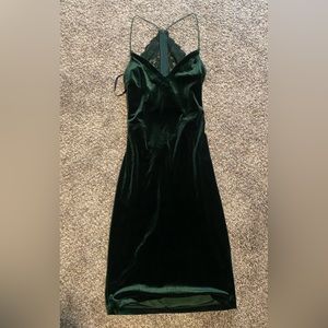 short dark green slim dress with a lace back